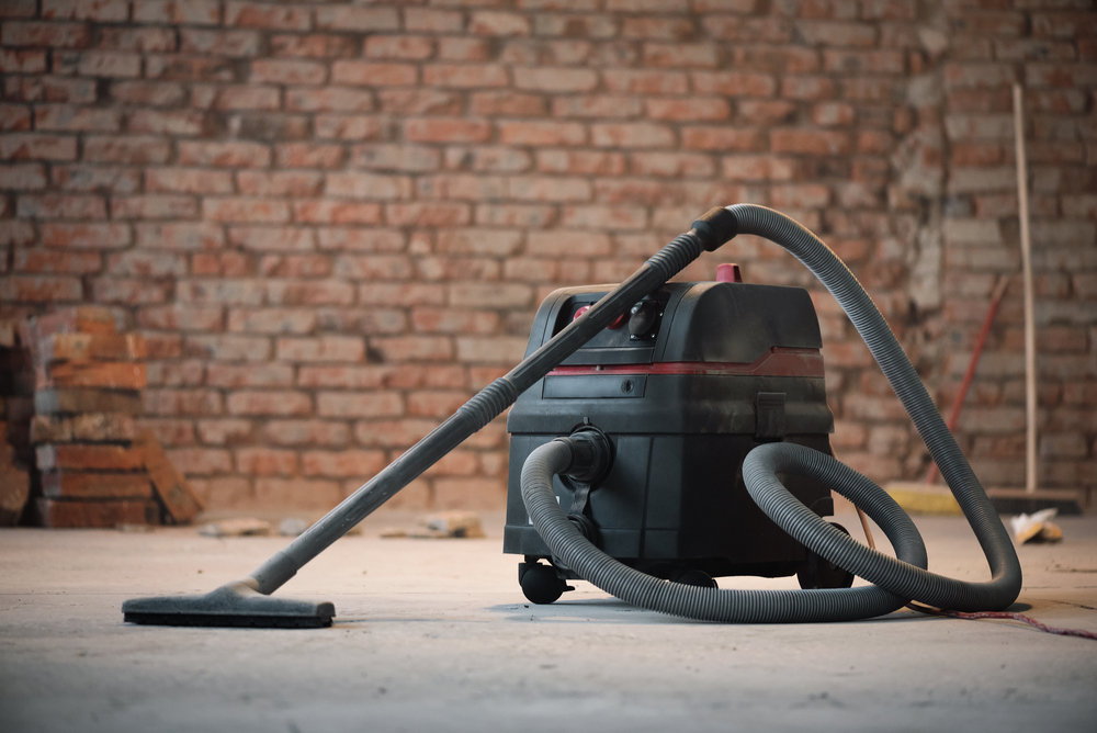 a cordless electriacally powered floor machine being used in a grocery store.