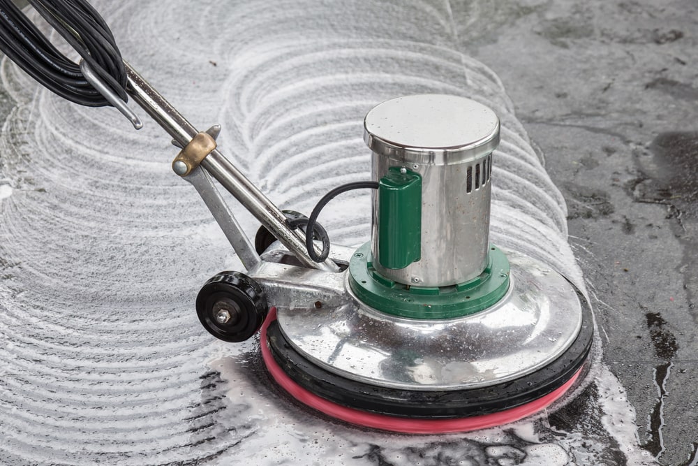 a floor buffer polishing a cement floor.