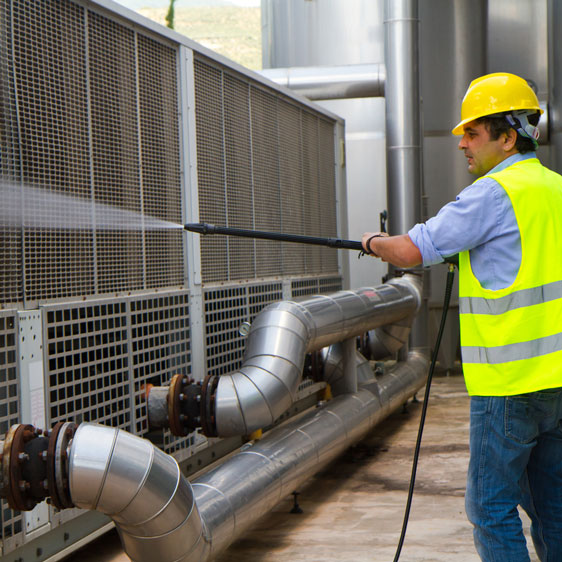 Cleaning an industrial facility with a pressure washer