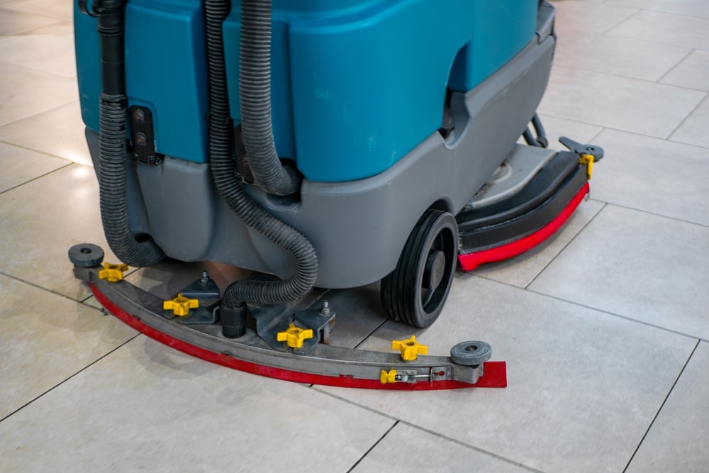 a floor machine with a squeegee attachment.